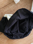 Baby meisje Louve bloomer rokje in zwart met creme kleurige stik en tailleband voor baby's en dreumes van 3 - 18 maanden close up broekje